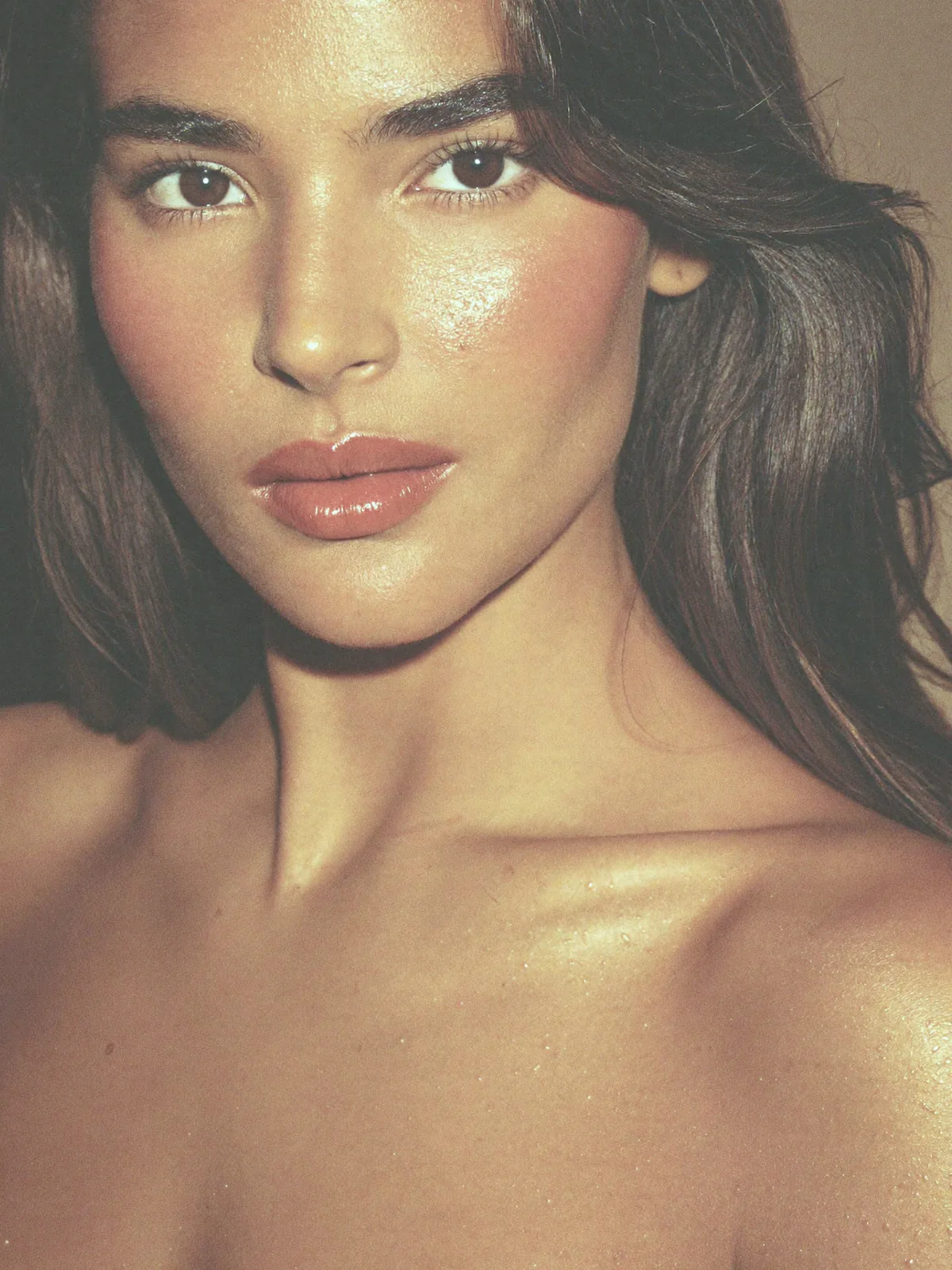 A woman's lips, cheek and jawline in warm daylight
